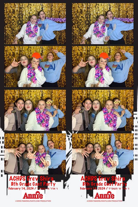 An example of kids having fun with a photo booth at a party